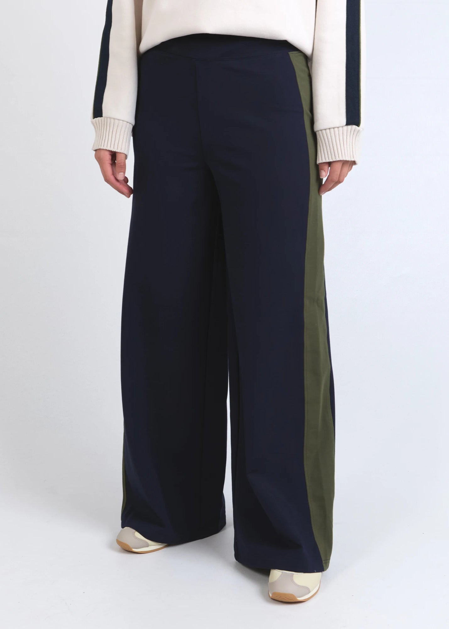 Navy wide-leg pants with a green stripe on a white background